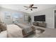 Bright bedroom with large windows, a TV, and modern décor at 17148 Waterhouse Cir # A, Parker, CO 80134