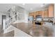 Bright kitchen featuring stainless steel appliances, wooden cabinets, and a spacious center island at 17148 Waterhouse Cir # A, Parker, CO 80134