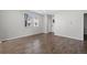 Spacious living room featuring hard wood floors, lots of windows, and a light gray paint at 17148 Waterhouse Cir # A, Parker, CO 80134