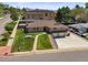 Aerial view of home with brick exterior, large lawn, and two car garage at 2704 S Ames Way, Denver, CO 80227