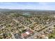 Beautiful areal view of a community near a lake with mountains in the distance at 2704 S Ames Way, Denver, CO 80227