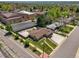 Aerial view of a neighborhood with a spacious lot, manicured lawn, and nearby amenities at 2704 S Ames Way, Denver, CO 80227