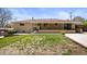 An exterior shot of the backyard with a partial view of the house at 2704 S Ames Way, Denver, CO 80227