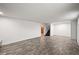 View of the basement featuring hardwood floors, white walls, and a staircase at 2704 S Ames Way, Denver, CO 80227