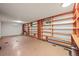 Basement featuring built-in wooden shelves and a small window at 2704 S Ames Way, Denver, CO 80227