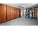 Basement with wooden cabinets, water heater, and furnace at 2704 S Ames Way, Denver, CO 80227