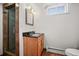Bathroom featuring shower, vanity, mirror, radiator, and toilet at 2704 S Ames Way, Denver, CO 80227