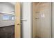 Bathroom view of the tiled shower stall with a detachable shower head at 2704 S Ames Way, Denver, CO 80227