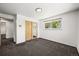 Bright neutral bedroom with carpet, a closet, and a window at 2704 S Ames Way, Denver, CO 80227