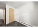 Neutral bedroom featuring plush carpet, a closet and easy access to additional rooms at 2704 S Ames Way, Denver, CO 80227