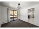 Open dining area with sliding glass doors to the patio and direct access to the kitchen at 2704 S Ames Way, Denver, CO 80227