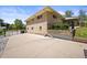 Back corner of a brick home and an enclosed patio at 2704 S Ames Way, Denver, CO 80227