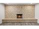 Stone fireplace in a finished basement at 2704 S Ames Way, Denver, CO 80227