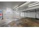 Unfinished garage featuring two garage doors at 2704 S Ames Way, Denver, CO 80227