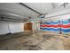 Garage with painted walls and one garage door at 2704 S Ames Way, Denver, CO 80227