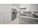Modern kitchen with stainless steel appliances, ample counter space, and a seamless layout for cooking at 2704 S Ames Way, Denver, CO 80227