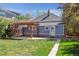 Backyard featuring a wooden pergola, patio, and a well-maintained lawn at 5101 Meade St, Denver, CO 80221