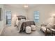 Cozy bedroom with plush carpet, comfortable bedding, and natural light from the window at 5101 Meade St, Denver, CO 80221