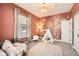 Charming bedroom featuring teepee accent, modern decor, and carpeted floors at 5101 Meade St, Denver, CO 80221