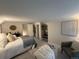 Cozy bedroom with soft carpet, a comfortable chair, and ample natural light at 5101 Meade St, Denver, CO 80221