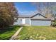 Detached single car garage with freshly cut green lawn at 5101 Meade St, Denver, CO 80221