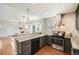 Modern kitchen with stainless steel appliances, granite countertops, and an open floor plan at 5101 Meade St, Denver, CO 80221