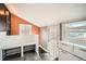 Bright mud room with built-in bench, storage, and a door leading to the outdoors at 5101 Meade St, Denver, CO 80221