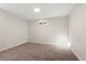 Neutral-toned bedroom featuring plush carpeting, white walls, and a window offering natural light at 1073 Galena St, Aurora, CO 80010