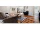 Bright living room with hardwood floors open to modern kitchen at 1073 Galena St, Aurora, CO 80010