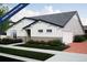 Under construction charming single-story home with white siding, gray accents, attached garage, and manicured lawn at 21917 E 51St Dr, Aurora, CO 80019