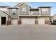 Modern townhome featuring garage parking and a balcony at 11975 Riverstone Cir # 9E, Henderson, CO 80640