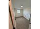 This is a cozy bedroom with neutral-toned walls, soft carpeting, and a window for natural light at 5535 Clear Creek Dr, Denver, CO 80212