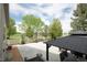 Backyard patio with basketball court, gravel area, view of community space, and privacy fence at 1510 S De Gaulle Cir, Aurora, CO 80018