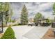 Large backyard patio featuring outdoor furniture, BBQ grill, and basketball court at 1510 S De Gaulle Cir, Aurora, CO 80018