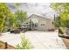Backyard patio with outdoor furniture, basketball court, and large sliding glass doors at 1510 S De Gaulle Cir, Aurora, CO 80018