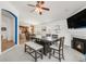 Spacious dining room featuring a fireplace, large table, chairs and bench seating at 1510 S De Gaulle Cir, Aurora, CO 80018