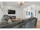 Cozy living room with vaulted ceilings, a modern fireplace, and comfortable seating at 1510 S De Gaulle Cir, Aurora, CO 80018