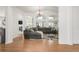 Spacious living room with vaulted ceilings, large windows, and a comfortable sectional sofa at 1510 S De Gaulle Cir, Aurora, CO 80018
