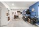 Finished basement space with seating area, work area, shelves, and bright blue accent wall at 1510 S De Gaulle Cir, Aurora, CO 80018