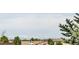 Mountain view over rooftops in the neighborhood at 1510 S De Gaulle Cir, Aurora, CO 80018