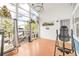 Bright sun room with hardwood floors, skylights, large windows, and an inversion table at 1510 S De Gaulle Cir, Aurora, CO 80018