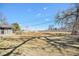 Large, grassy backyard perfect for recreation, with a glimpse of the home at 2208 Champlain Dr, Boulder, CO 80301