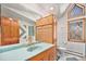 Bathroom with light blue sink, patterned tiles, and window at 2208 Champlain Dr, Boulder, CO 80301