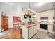 Open kitchen and dining area featuring tile and wood flooring at 2208 Champlain Dr, Boulder, CO 80301