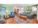Cozy living room featuring hardwood floors, a comfortable couch, and an open floor plan at 2208 Champlain Dr, Boulder, CO 80301
