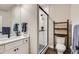 Modern bathroom with glass-enclosed shower, floating vanity, and stylish fixtures at 3261 S Sherman St, Englewood, CO 80113