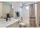 Bright bathroom featuring white subway tile shower, modern vanity, and sleek black fixtures at 3261 S Sherman St, Englewood, CO 80113