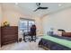 Inviting bedroom with a comfortable bed, functional desk, and ample natural light at 3261 S Sherman St, Englewood, CO 80113