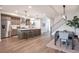 Open-concept kitchen with a large island, modern appliances, and ample counter space, perfect for cooking at 3261 S Sherman St, Englewood, CO 80113