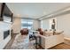 Bright living room showcasing a plush sectional, modern fireplace, and expansive windows at 3261 S Sherman St, Englewood, CO 80113